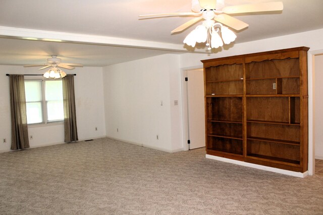 unfurnished room featuring carpet flooring and a ceiling fan
