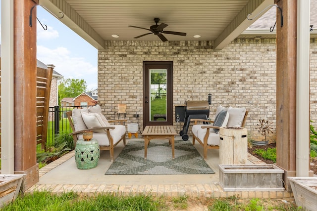 view of patio / terrace with fence and a ceiling fan