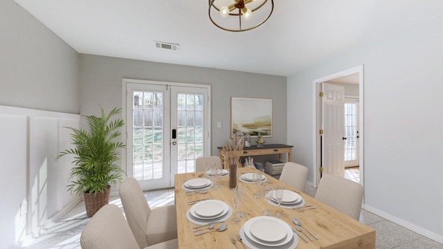211 W 17th St, Columbia, TN 38401 - dining space with french doors, baseboards, a chandelier, and visible vents