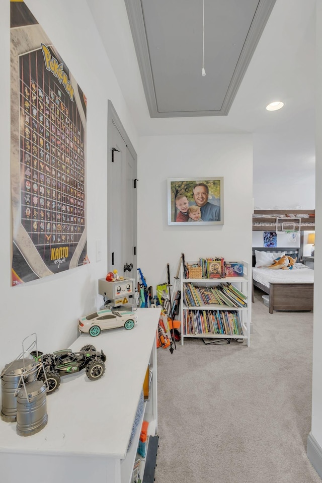 playroom with carpet floors and attic access