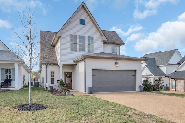 view of front of home featuring roof with shingles, central AC, a front lawn, a garage, and concrete driveway