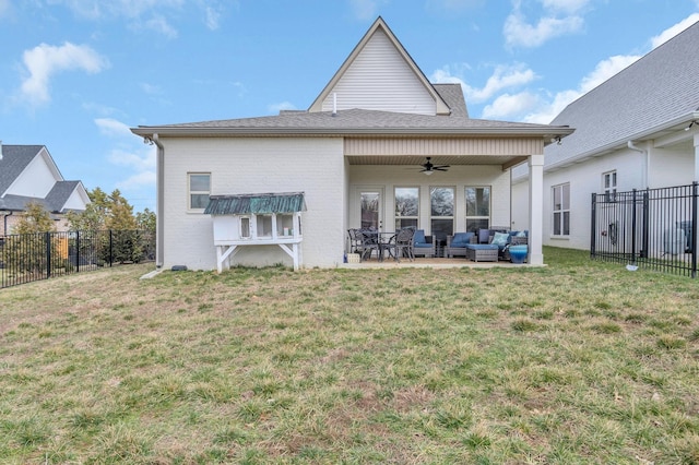 rear view of house featuring an outdoor living space, a ceiling fan, a fenced backyard, and a yard