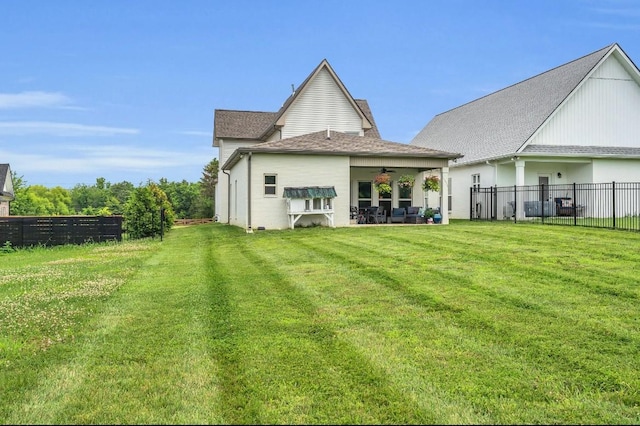 1572 John Galt Dr, Lebanon, TN 37087 - back of house featuring ceiling fan, a fenced backyard, a patio, and a shingled roof