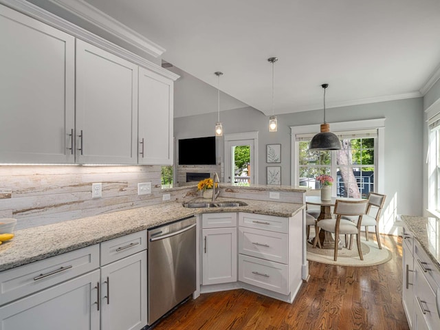 kitchen featuring dark wood-style flooring, a sink, white cabinetry, a peninsula, and stainless steel dishwasher