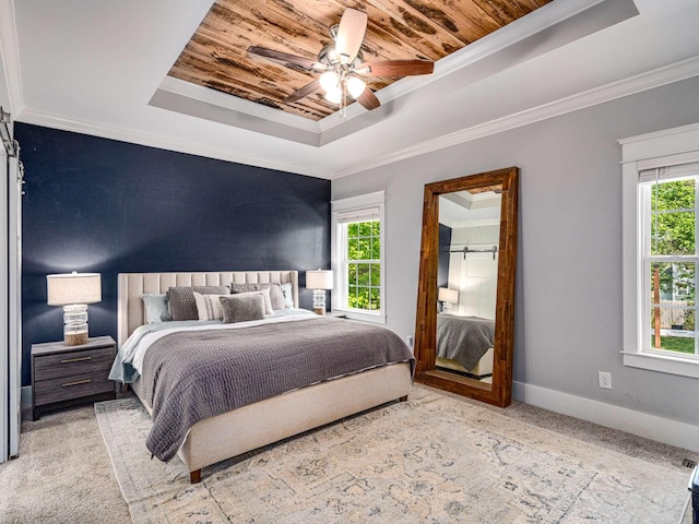 carpeted bedroom featuring ceiling fan, a raised ceiling, baseboards, wooden ceiling, and ornamental molding