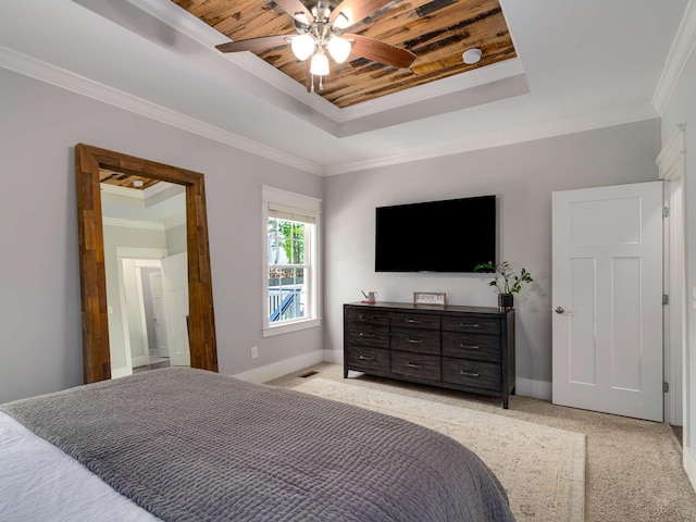 bedroom featuring a raised ceiling, baseboards, a ceiling fan, and light colored carpet