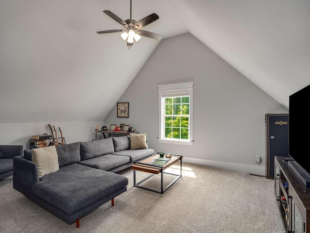 carpeted living room featuring a ceiling fan and lofted ceiling