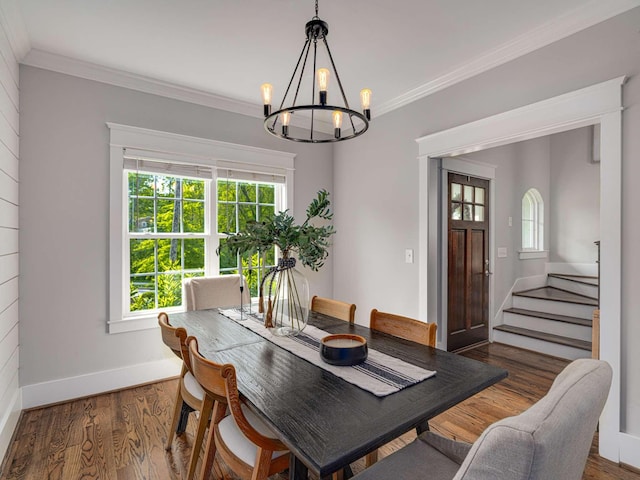dining room with an inviting chandelier, baseboards, stairs, and a wealth of natural light