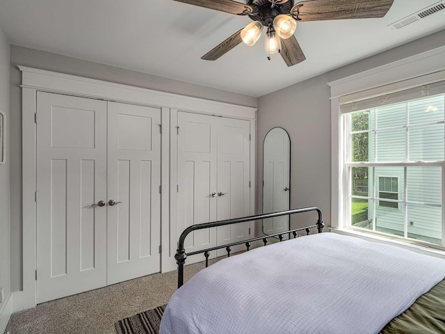 bedroom featuring a ceiling fan and visible vents