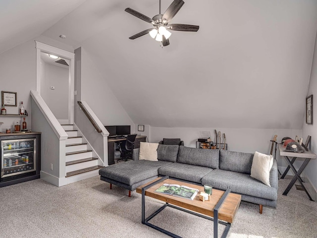 living area featuring a dry bar, carpet, beverage cooler, and lofted ceiling