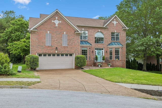104 Drayton Ct, Franklin, TN 37067 - view of front facade featuring concrete driveway, brick siding, an attached garage, and a front yard
