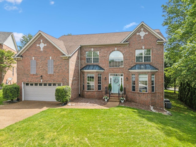 104 Drayton Ct, Franklin, TN 37067 - colonial-style house with roof with shingles, a front yard, a garage, brick siding, and concrete driveway