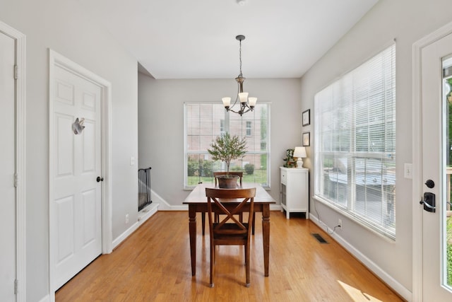 104 Drayton Ct, Franklin, TN 37067 - dining space with light wood-type flooring, baseboards, a chandelier, and visible vents