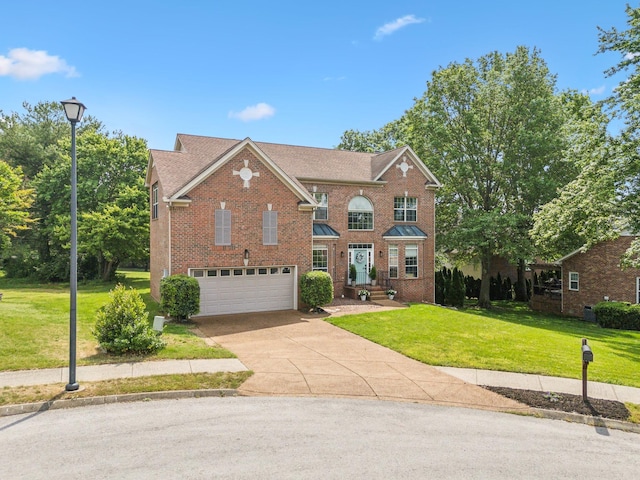 104 Drayton Ct, Franklin, TN 37067 - traditional home with a garage, concrete driveway, a front lawn, and brick siding