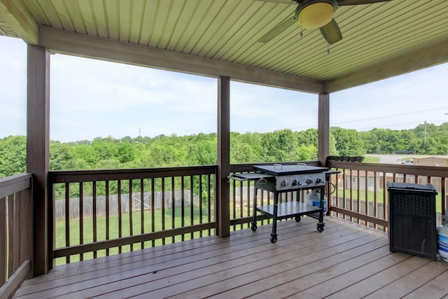 wooden deck featuring a ceiling fan