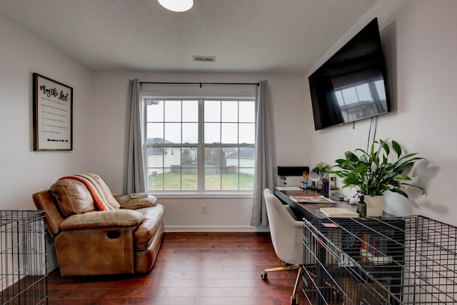 office featuring baseboards, dark wood finished floors, and visible vents