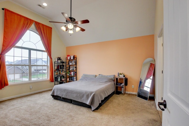 carpeted bedroom with baseboards, ceiling fan, vaulted ceiling, and visible vents