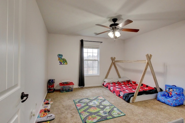 bedroom featuring carpet flooring, a ceiling fan, and baseboards