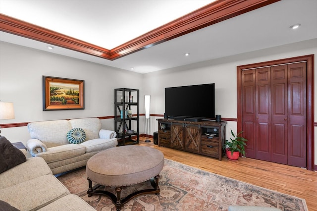 living room featuring ornamental molding, recessed lighting, and wood finished floors