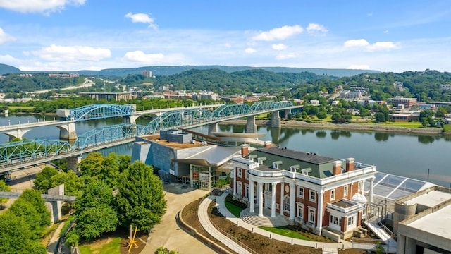 birds eye view of property featuring a water and mountain view