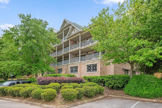 view of property with uncovered parking