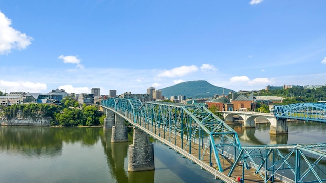 exterior space with a view of city and a water and mountain view
