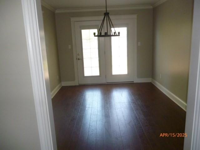 1314 Jewell Dr, Columbia, TN 38401 - interior space with baseboards, ornamental molding, dark wood-style flooring, and a notable chandelier