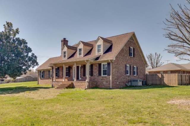 1314 Jewell Dr, Columbia, TN 38401 - cape cod-style house with a porch, a chimney, brick siding, fence, and a front lawn
