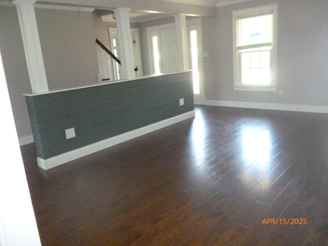 1314 Jewell Dr, Columbia, TN 38401 - unfurnished living room with baseboards, wood finished floors, ornate columns, ornamental molding, and stairway