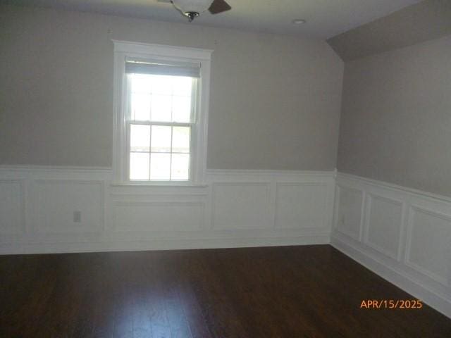 1314 Jewell Dr, Columbia, TN 38401 - unfurnished room featuring dark wood finished floors, a decorative wall, a wainscoted wall, and vaulted ceiling