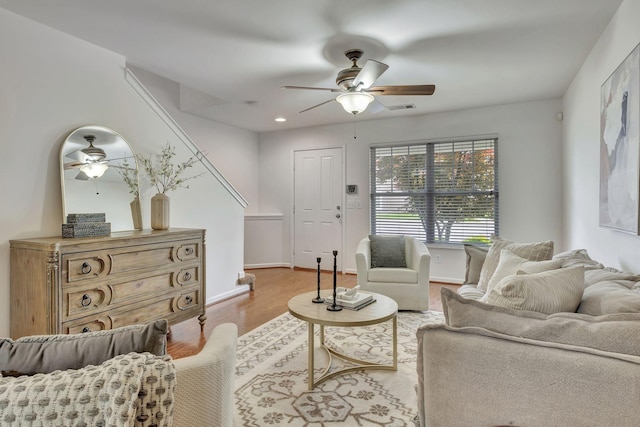 living room featuring visible vents, wood finished floors, baseboards, recessed lighting, and a ceiling fan
