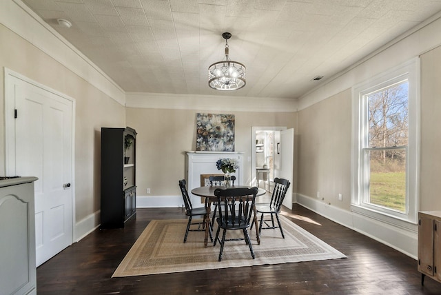 1614 Wade Rd, Lewisburg, TN 37091 - dining room with healthy amount of natural light, a chandelier, dark wood-type flooring, crown molding, and baseboards
