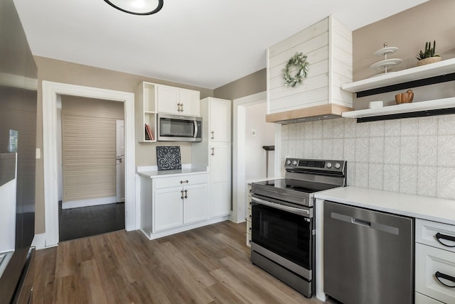 1614 Wade Rd, Lewisburg, TN 37091 - kitchen featuring appliances with stainless steel finishes, open shelves, light countertops, decorative backsplash, and dark wood-style floors