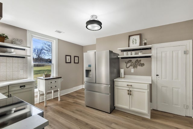 1614 Wade Rd, Lewisburg, TN 37091 - kitchen featuring open shelves, stainless steel fridge with ice dispenser, light countertops, and light wood finished floors