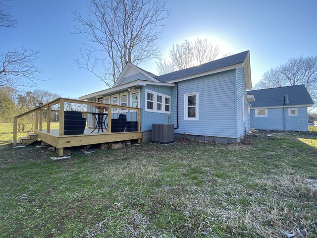 1614 Wade Rd, Lewisburg, TN 37091 - back of property with a deck, central air condition unit, a lawn, and board and batten siding