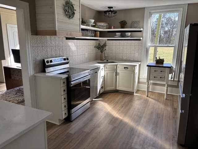 1614 Wade Rd, Lewisburg, TN 37091 - kitchen with stainless steel appliances, open shelves, a sink, light wood-type flooring, and backsplash