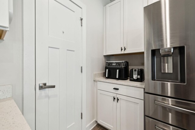 907 Caywood Rd, Smyrna, TN 37167 - kitchen with a warming drawer, stainless steel fridge, and white cabinets