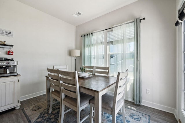 907 Caywood Rd, Smyrna, TN 37167 - dining area featuring dark wood finished floors, visible vents, and baseboards