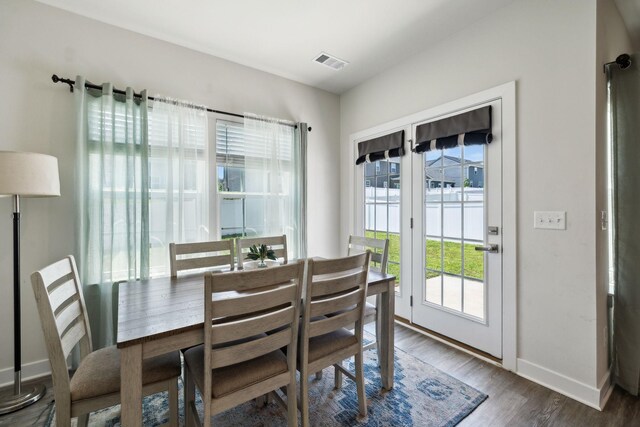 907 Caywood Rd, Smyrna, TN 37167 - dining room with baseboards, visible vents, and wood finished floors