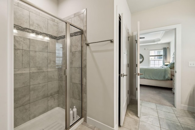 907 Caywood Rd, Smyrna, TN 37167 - full bathroom with a stall shower, tile patterned floors, baseboards, a raised ceiling, and ensuite bath