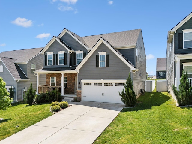 907 Caywood Rd, Smyrna, TN 37167 - craftsman-style house with covered porch, a front yard, an attached garage, and driveway