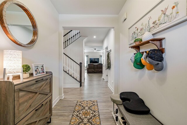 907 Caywood Rd, Smyrna, TN 37167 - hallway featuring stairs, baseboards, light wood-style flooring, and recessed lighting