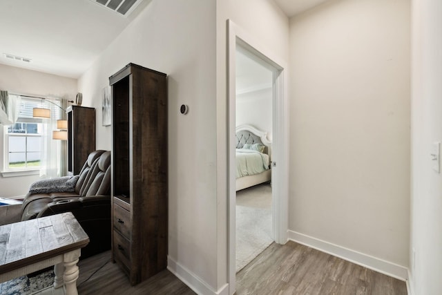 907 Caywood Rd, Smyrna, TN 37167 - hallway with baseboards, visible vents, and wood finished floors