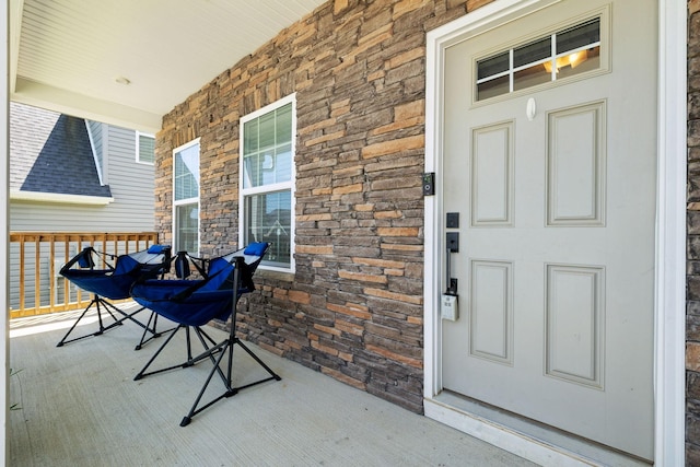 907 Caywood Rd, Smyrna, TN 37167 - property entrance with covered porch and stone siding