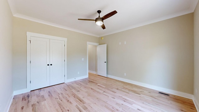 1150 Parsons Rd, Christiana, TN 37037 - unfurnished bedroom with visible vents, ornamental molding, light wood finished floors, and baseboards