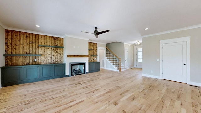 1150 Parsons Rd, Christiana, TN 37037 - unfurnished living room featuring stairway, ceiling fan, light wood-style flooring, and crown molding
