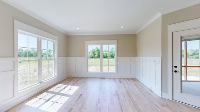 1150 Parsons Rd, Christiana, TN 37037 - unfurnished room with a decorative wall, ornamental molding, wainscoting, and light wood finished floors