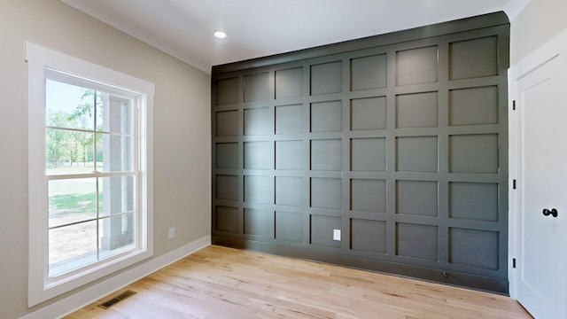 1150 Parsons Rd, Christiana, TN 37037 - interior space featuring a decorative wall, baseboards, visible vents, and light wood-style floors