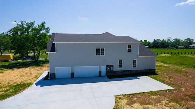 1150 Parsons Rd, Christiana, TN 37037 - view of property exterior with concrete driveway, a lawn, roof with shingles, and a garage