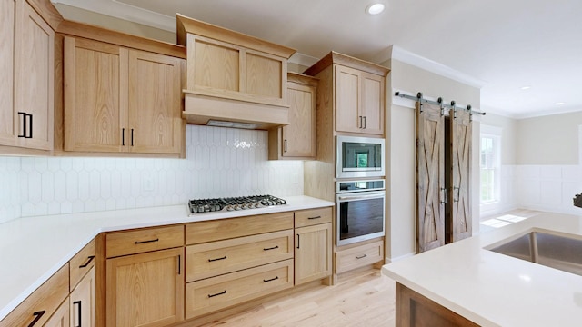 1150 Parsons Rd, Christiana, TN 37037 - kitchen with light brown cabinetry, a barn door, light countertops, a sink, and appliances with stainless steel finishes